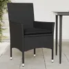 A black poly rattan garden chair with a black cushion sits on a tiled patio next to a table leg. Voir les images du produit
