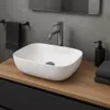 A modern bathroom sink setup with a countertop basin, faucet, and accessories. Náhľad obrázku produktu