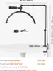A desk lamp with a phone holder clamped to a table, with dimensions and specifications shown. Produktbild-Vorschau