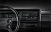A close-up shot of a car's dashboard, focusing on the steering wheel and the car stereo system. Voir les images du produit