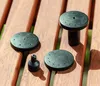 Four black fountain nozzles are arranged on a wooden surface. Náhľad obrázku produktu