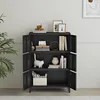 A black metal cabinet with multiple shelves and doors, styled with decorative items. Voir les images du produit