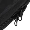 A close-up view of two black zippers on a black fabric surface. Podgląd zdjęcia produktu