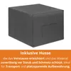 A dark gray cube-shaped ottoman or storage box with a textured fabric cover, shown in a studio setting with a white background. Text below describes its features. Produktbild-Vorschau