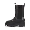 A studio shot of a single black boot. Voir les images du produit