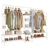 A white garment rack filled with clothes and accessories, with shelves for shoes and storage boxes. Produktbild-Vorschau