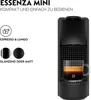 A black Nespresso Essenza Mini coffee machine with a cup of espresso on a white background, with text describing its features. Produktbild-Vorschau