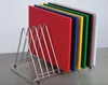 A set of colored cutting boards in a metal rack. Anteprima dell’immagine prodotto