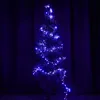 A decorated Christmas tree with blue lights. Produktbild-Vorschau