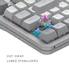 Close-up view of a mechanical keyboard with keycaps removed to show the hot-swappable switches and lubed stabilizers. Produktbild-Vorschau
