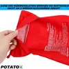 A hand is opening a red potato cooking bag, revealing a red and white checkered interior. Produktbild-Vorschau