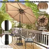 A patio umbrella and table set on a wooden deck. Voir les images du produit