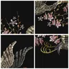 A collage of four embroidered images featuring birds and flowers on a black background. Produktbild-Vorschau