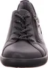 A close-up, front-facing view of a black leather women's sneaker. Produktbild-Vorschau