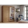 A bedroom scene featuring a wardrobe, armchair, and bed. Náhled obrázku produktu