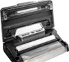 A vacuum sealer with its lid open, showing the sealing mechanism and a roll of vacuum sealing bags. Podgląd zdjęcia produktu
