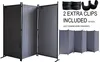 A collage of room dividers in gray fabric with black frames. The main image shows a three-panel room divider from the front-left. A smaller image shows a four-panel room divider from the front-right. Above the smaller image are three black clips and text i Produktbild-Vorschau