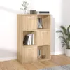 A wooden shelving unit with six compartments, some containing books, a framed picture, and decorative items. A potted plant is visible to the right. Náhled obrázku produktu