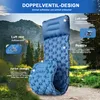 A blue camping sleeping mat is shown in a natural outdoor setting with mountains and trees in the background. Produktbild-Vorschau