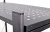 A close-up view of a black metal shelf with a perforated surface and a corner support. Anteprima dell’immagine prodotto