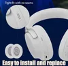 Close-up marketing image of white headphones, showing ear pads and a detail of the ear cup. Anteprima dell’immagine prodotto
