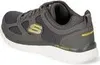 A side view of a gray Skechers sneaker with a yellow 'S' logo. Anteprima dell’immagine prodotto