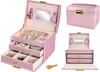 A collage of images showing a pink jewelry box from different angles and states of openness. Náhled obrázku produktu