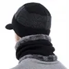 A person wearing a winter hat and scarf set. Produktbild-Vorschau