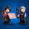 Two LEGO Marvel minifigures, Hawkeye and Kate Bishop, are shown holding a pizza box with a target and the words 'Hit the Spot' printed on it. Náhled obrázku produktu