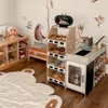 A child's play area with a wooden market stand and toys. Produktbild-Vorschau