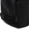 A close-up view of the side of a black backpack, showing a zipper and a strap. Anteprima dell’immagine prodotto