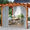 An outdoor patio set with a wooden pergola, dining table, chairs, and curtains. Anteprima dell’immagine prodotto
