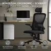 A black ergonomic office chair is shown in a home office setting with a desk, computer, and filing cabinet. Produktbild-Vorschau