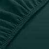 A close-up view of a dark teal fabric with elastic gathering. Podgląd zdjęcia produktu