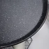 Close-up view of a black crepe pan with a speckled granite coating. Náhľad obrázku produktu