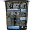 The image shows the side of a black cup containing instant noodles, with detailed nutritional information and preparation instructions printed on it. Produktbild-Vorschau