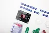 A collection of electronic building blocks and components are laid out on a white background. Podgląd zdjęcia produktu