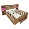 A modern wooden bed frame with integrated storage and LED lighting. Náhled obrázku produktu