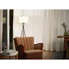 A cozy living room scene with a brown armchair, a floor lamp, and a small side table. Anteprima dell’immagine prodotto