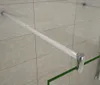 A close-up view of a shower enclosure's support bar and glass panel. Produktbild-Vorschau