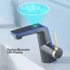 A modern faucet with a digital temperature display and LED lighting, shown in a bathroom sink setting. Produktbild-Vorschau