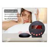 A woman is in bed, covering her ears with a pillow, while a vibrating alarm clock is shown on the bedside table. Náhľad obrázku produktu