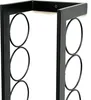 A close-up view of a black metal wine rack with circular holders. Náhled obrázku produktu
