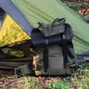 A sleeping bag is placed in front of an open tent in a natural outdoor setting. Produktbild-Vorschau