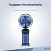 A blue portable handheld fan with a digital display, resting on its base against a gradient background. Produktbild-Vorschau