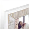A close-up of a vintage wooden picture frame with a woman visible in the reflection. Anteprima dell’immagine prodotto
