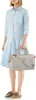 A woman stands in front of a white background, holding a bag. Anteprima dell’immagine prodotto
