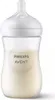 A clear studio shot of a baby bottle filled with milk. Podgląd zdjęcia produktu
