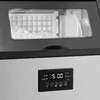 A close-up view of the top and front panel of an ice maker, showing the ice bin and the control panel. Produktbild-Vorschau