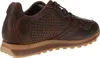A side view of a brown leather sneaker with perforations. Voir les images du produit